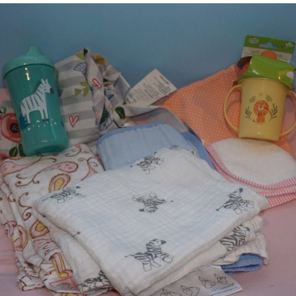 New and used swaddles, sippy cups, Boppy nursing pillow cover, burp cloths, etc.